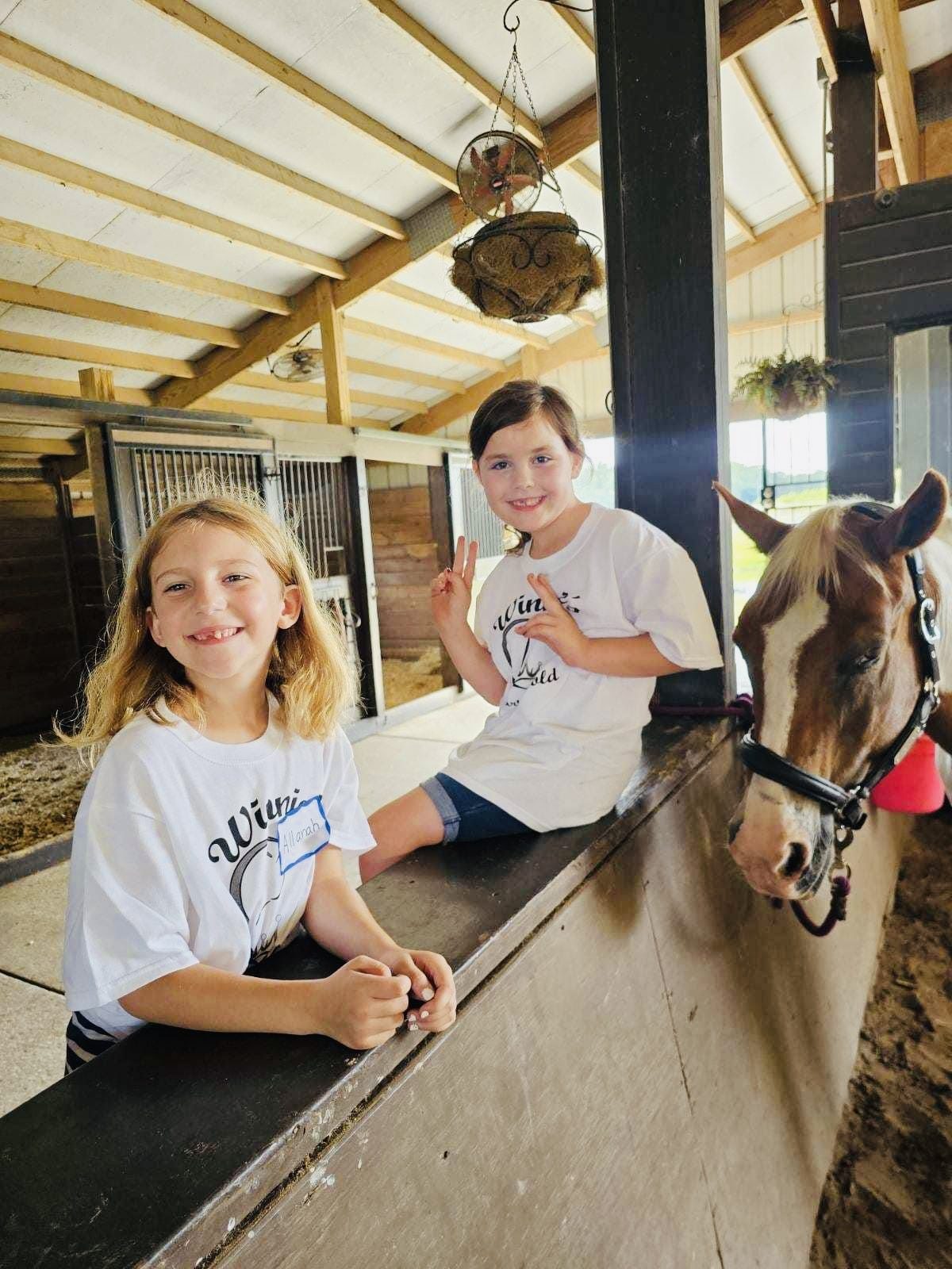 Young rider with a camp horse